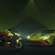 A Lamborghini Huracan STO and a Ducati Streetfighter Lamborghini enjoy a laser show.